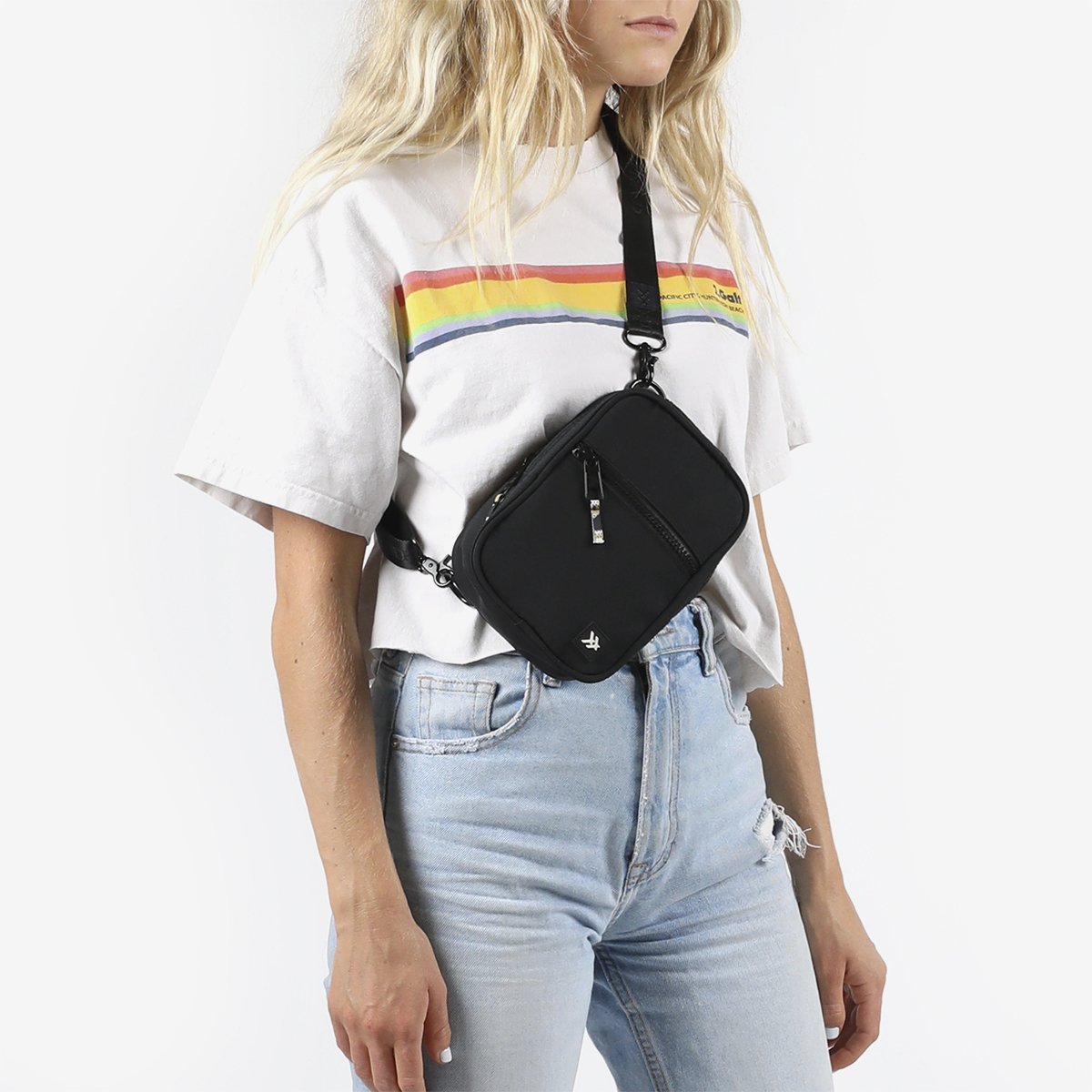 Person wearing the Thread® Black crossbody bag across the chest